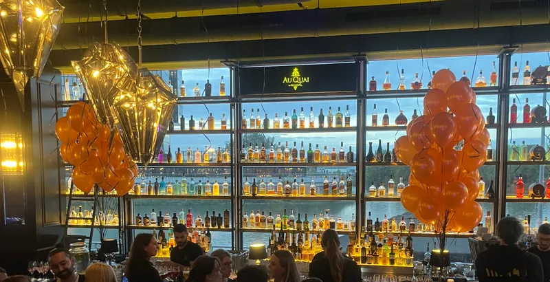 Party with balloons and illuminated bottle wall at Au Quai, Medienhafen