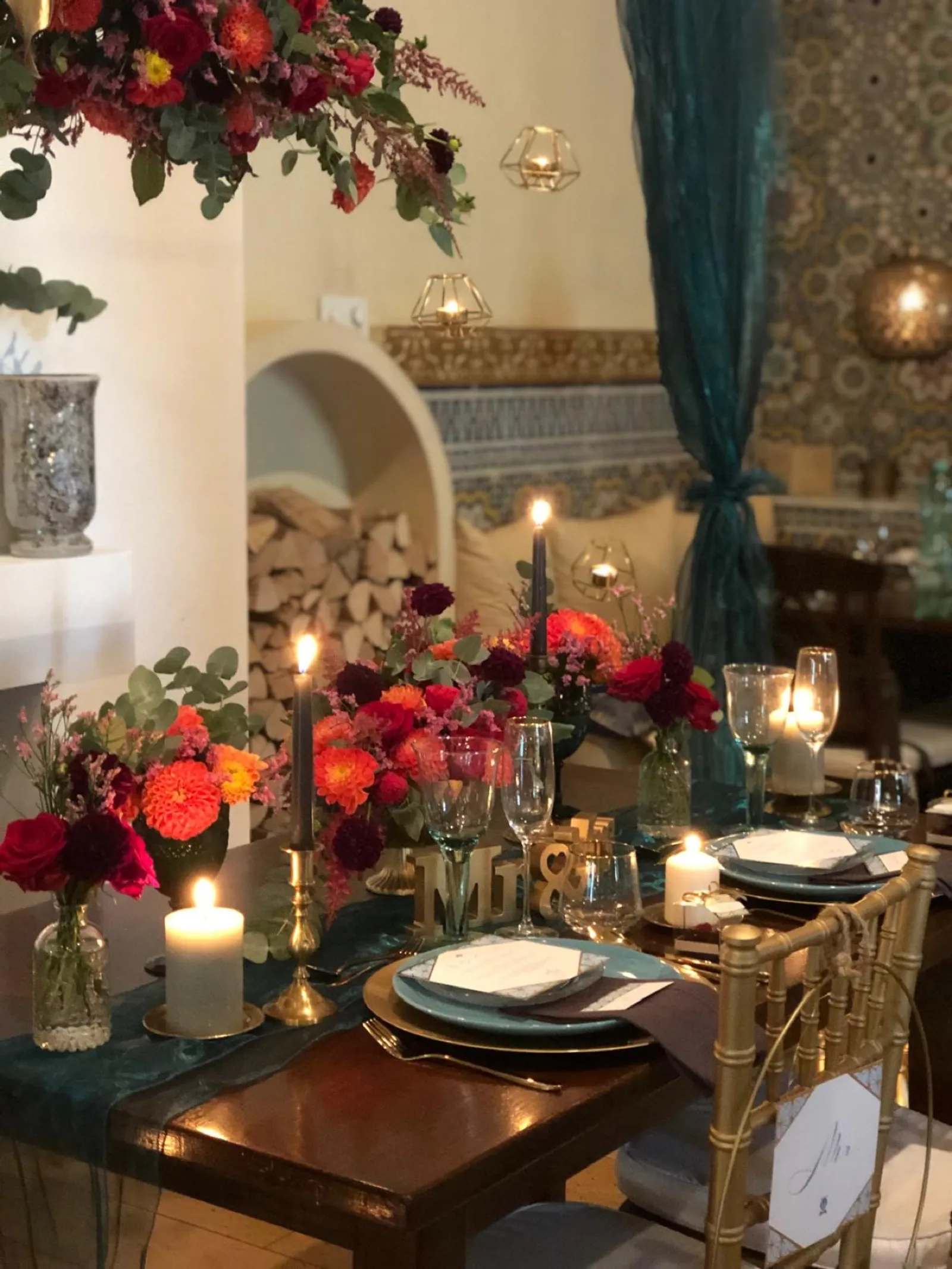Festively set table with flowers and candlelight for a private celebration